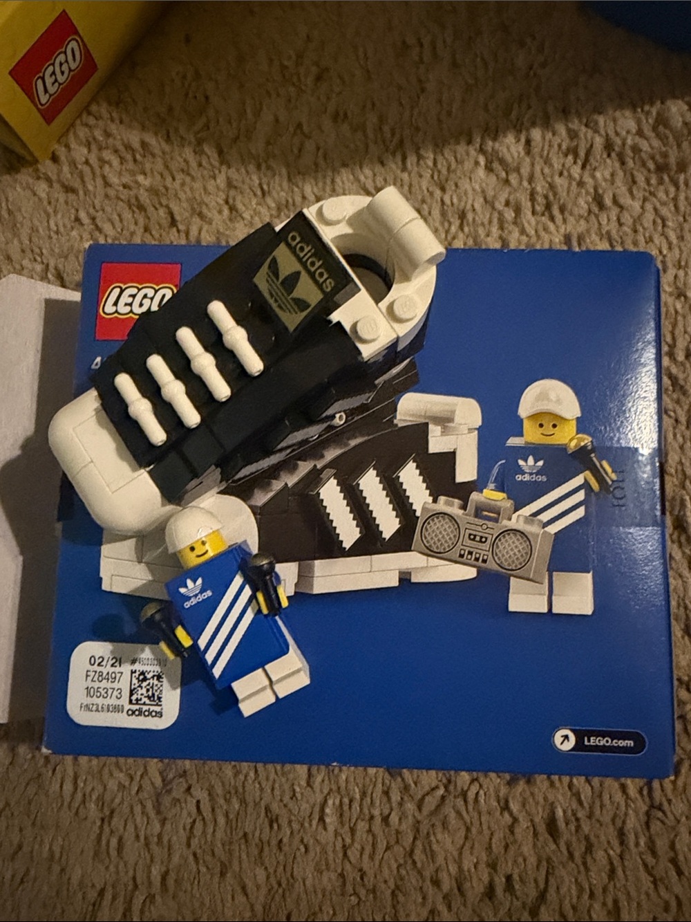adidas Black and White LEGO Sneaker Display with Blue Minifigures